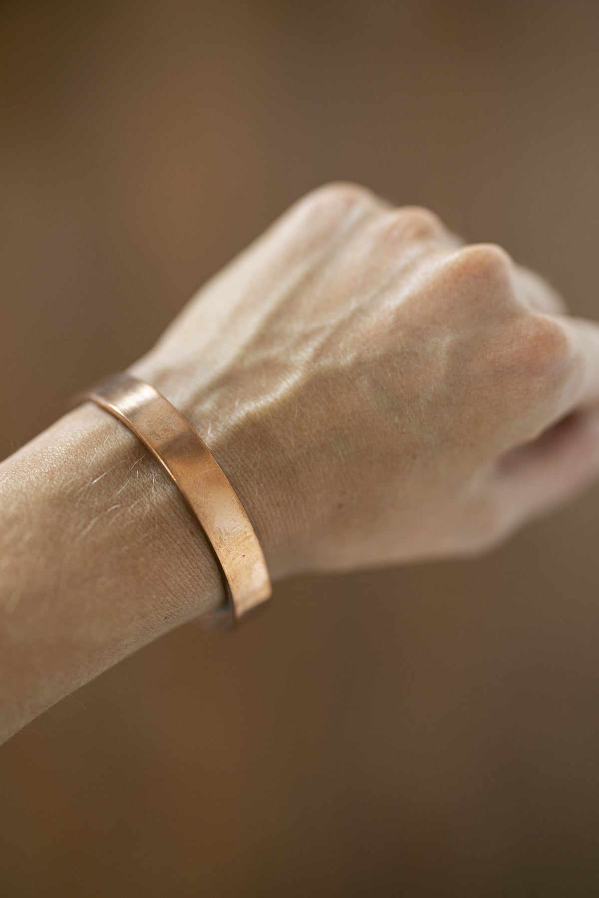 Kopero Copper Bracelet Smooth on the wrist, close-up of the flat copper cuff