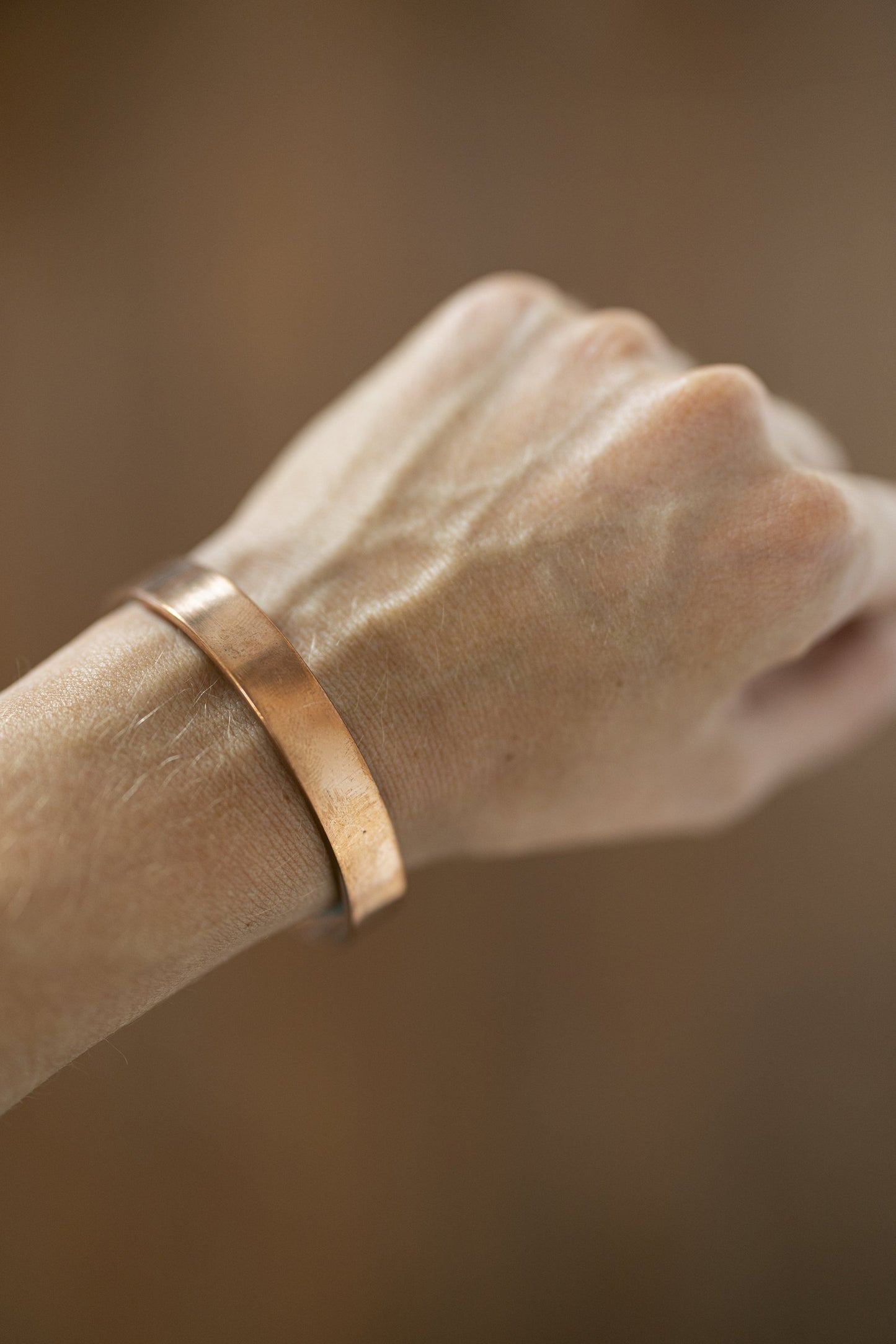 Kopero Copper Bracelet Smooth on the wrist, close-up of the flat copper cuff