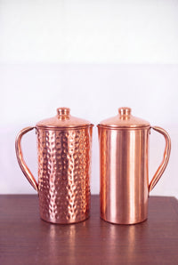 Kopero Copper Jug with lid, both versions side by side on a wooden table