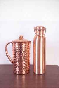 Kopero Copper Jug Hammered next to the copper water bottle from the Kopero collection