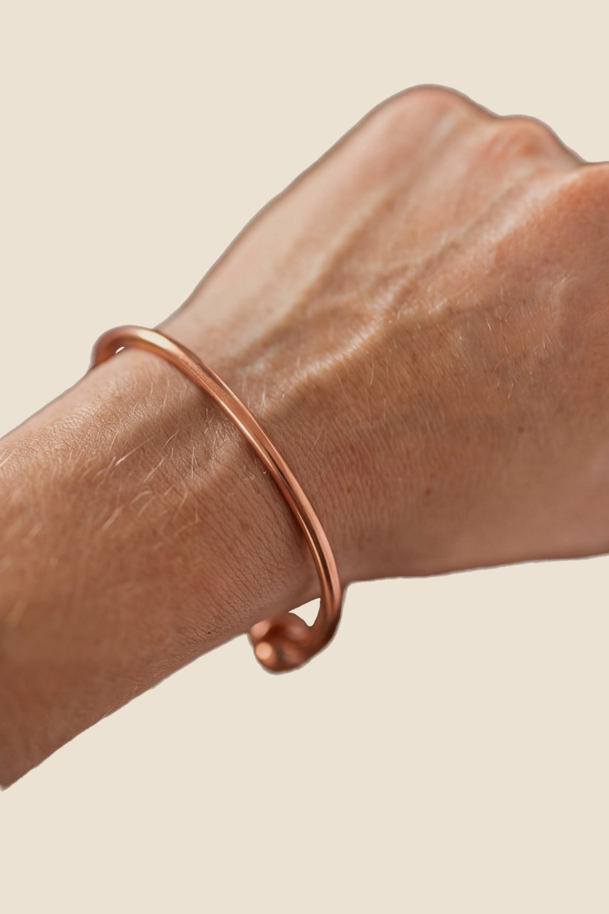 Kopero Copper Bracelet Round, on the wrist, product photo on a white background