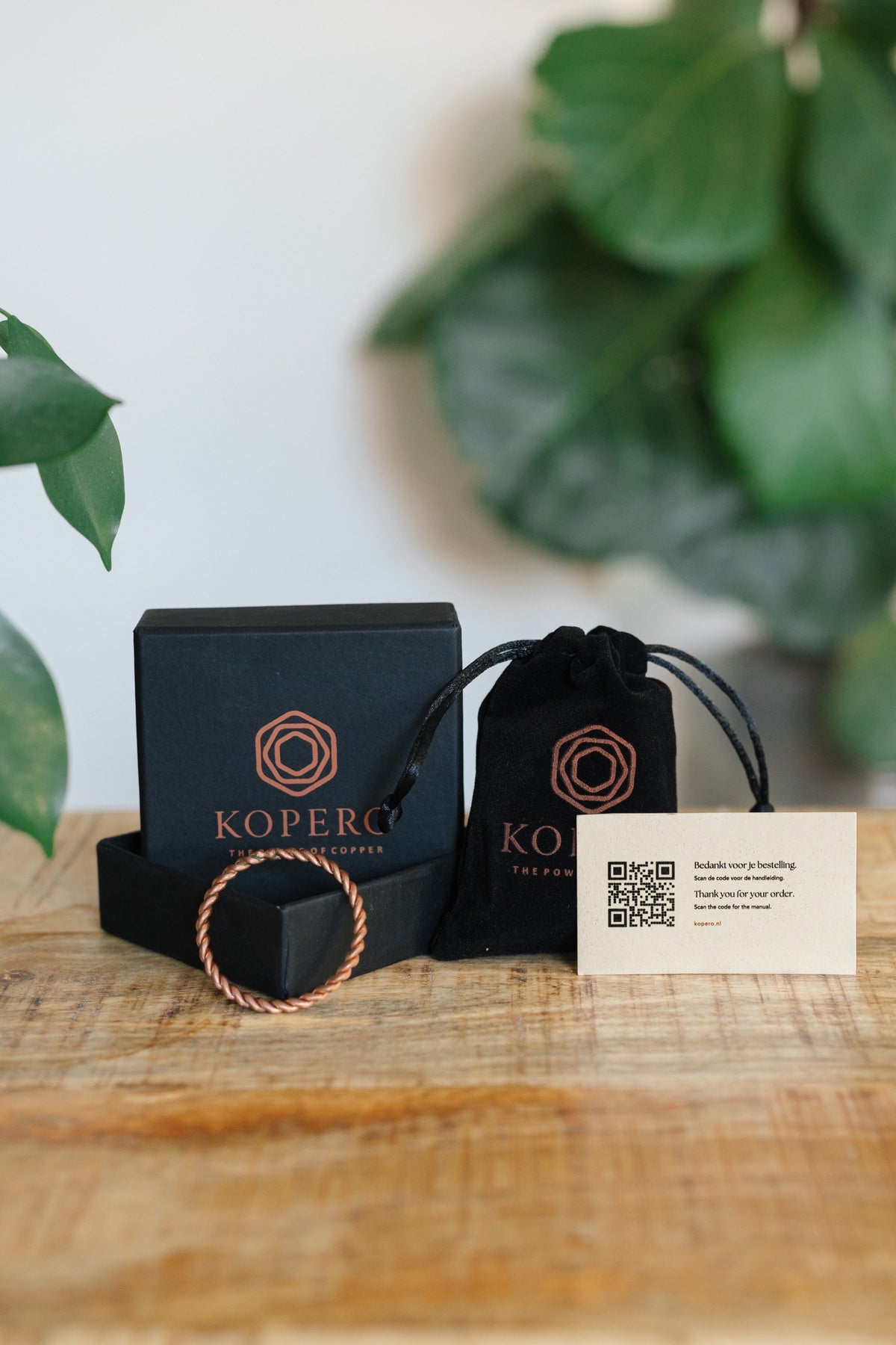 Kopero Copper Tensor Ring, with the black branded box, the velvet pouch and the thank-you card