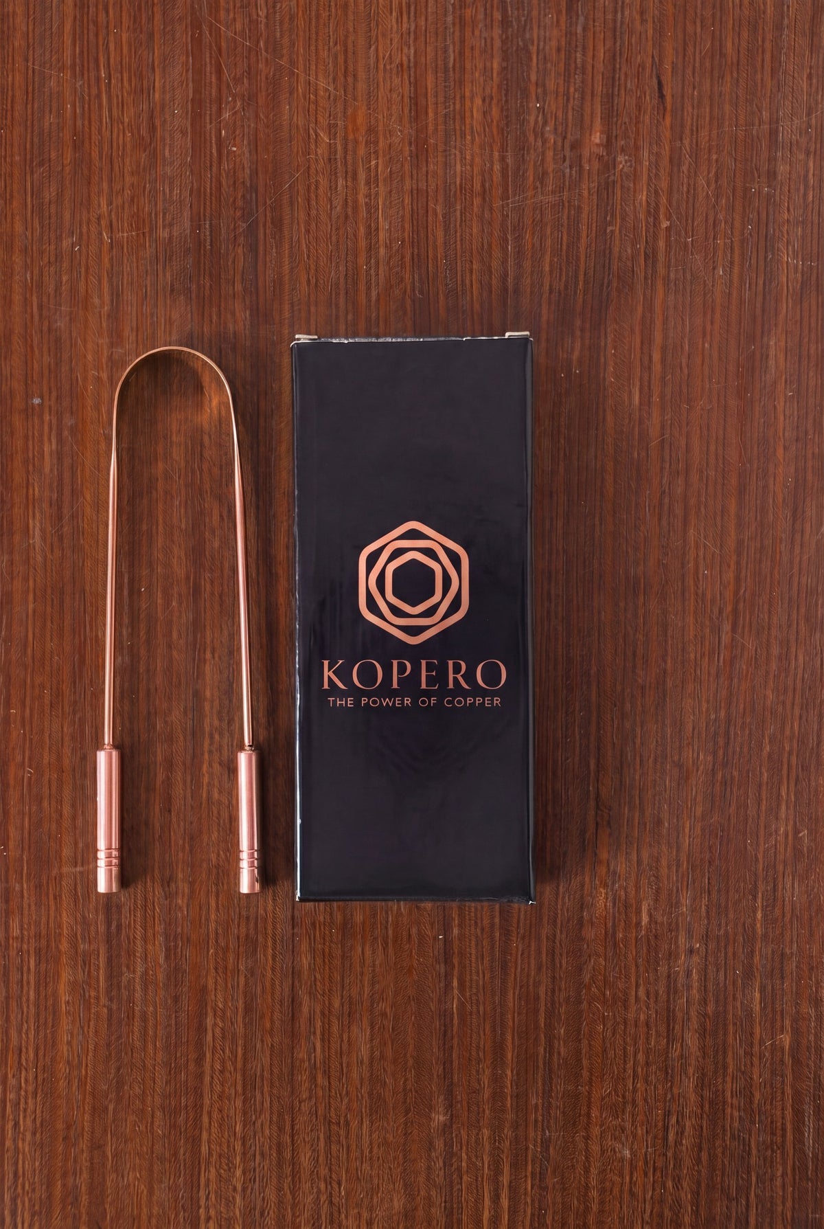 Kopero Copper Tongue Scraper next to the black gift box