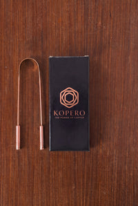 Kopero Copper Tongue Scraper next to the black gift box